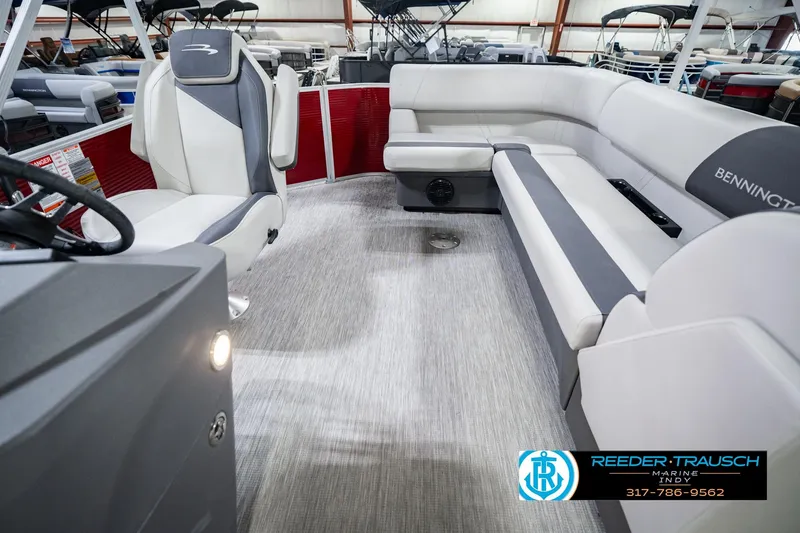 Slide: The Image of 2025 Bennington 20 SLS pontoon boat interior with plush seating and modern design. - 21
