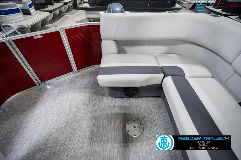 Slide: The Image of 2025 Bennington 20 SLS pontoon boat interior with gray seating and red paneling. - 22