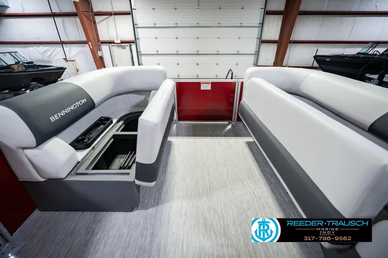Slide: The Image of 2025 Bennington 20 SLS pontoon boat interior with spacious seating and storage compartments. - 27