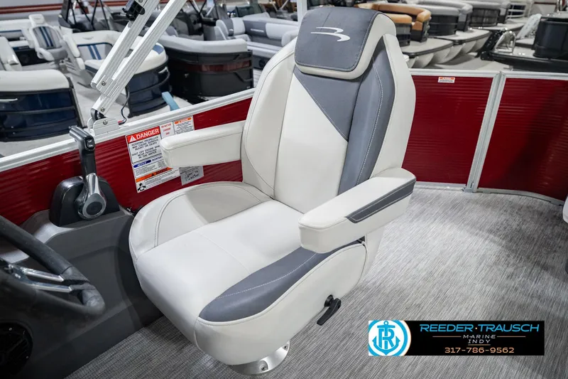 Slide: The Image of 2025 Bennington 20 SLS boat seat with gray and white upholstery in showroom setting. - 30