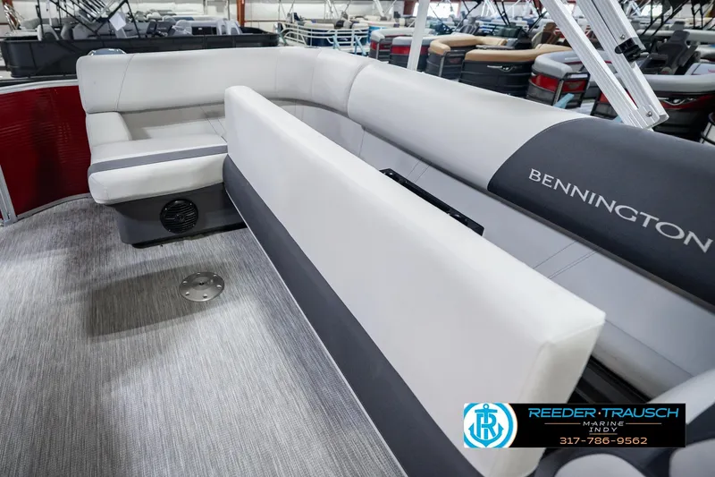 Slide: The Image of 2025 Bennington 20 SLS pontoon boat interior with plush seating and modern design. - 34