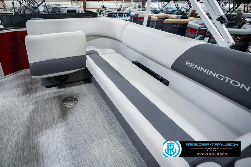 Slide: The Image of 2025 Bennington 20 SLS pontoon boat interior with gray seating and logo. - 35