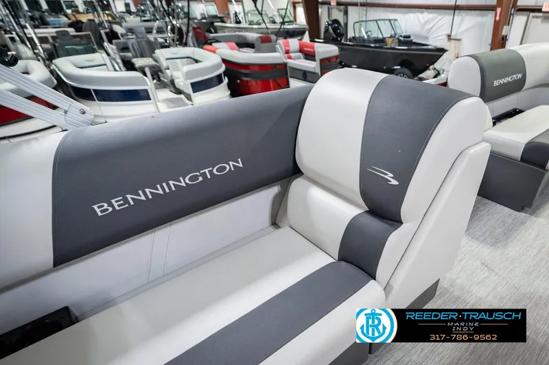 Slide: The Image of 2025 Bennington 20 SLS boat interior with gray and white seating in showroom. - 36