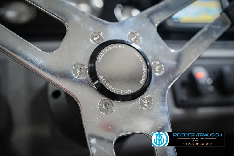 Slide: The Image of Steering wheel of 2025 Bennington 20 SLS boat, featuring sleek metallic design. - 40