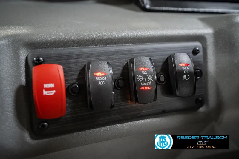 Slide: The Image of Control panel of a 2025 Bennington 20 SLS boat with labeled switches. - 41