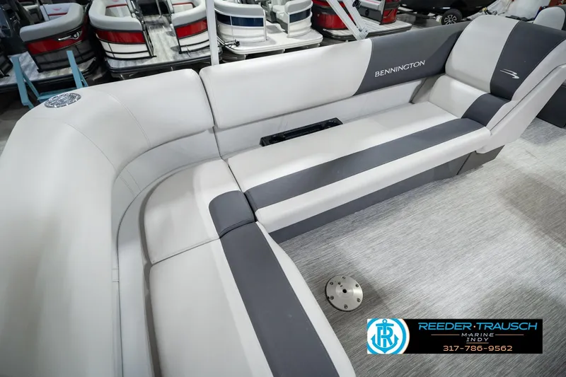 Slide: The Image of 2025 Bennington 20 SLS boat interior with gray seating and logo. - 49