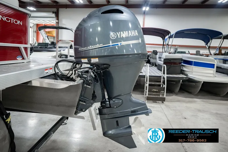 Slide: The Image of 2025 Bennington 20 SLS pontoon boat with Yamaha four-stroke outboard motor in showroom. - 55