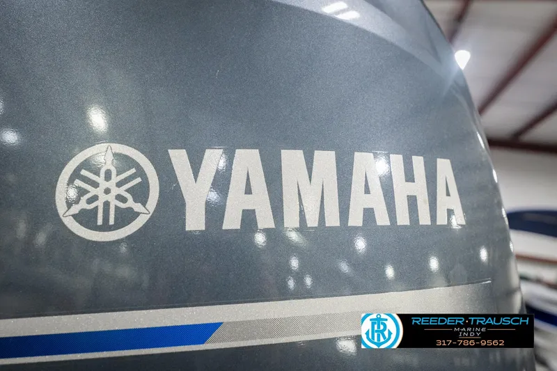 Slide: The Image of Yamaha logo on 2025 Bennington 20 SLS boat engine at Reeder Trausch Marine. - 56