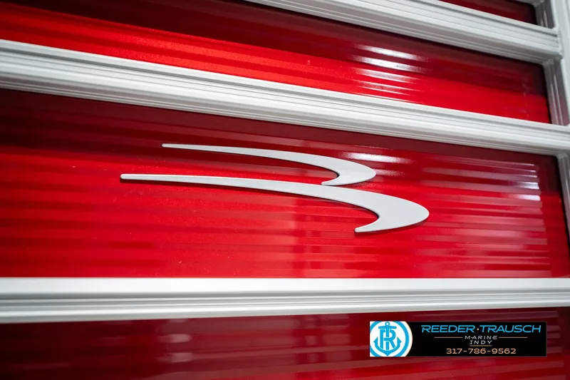 Slide: The Image of Red Bennington 20 SLS 2025 boat panel with logo and dealership contact information. - 59