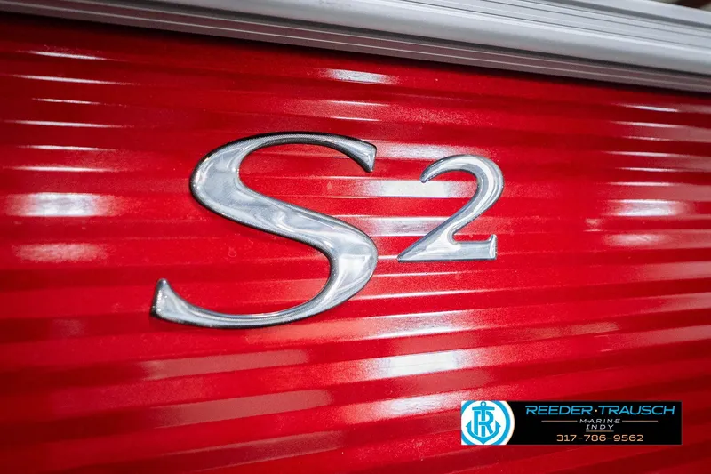 Slide: The Image of Close-up of 2025 Bennington 20 SLS boat emblem on vibrant red surface. - 61