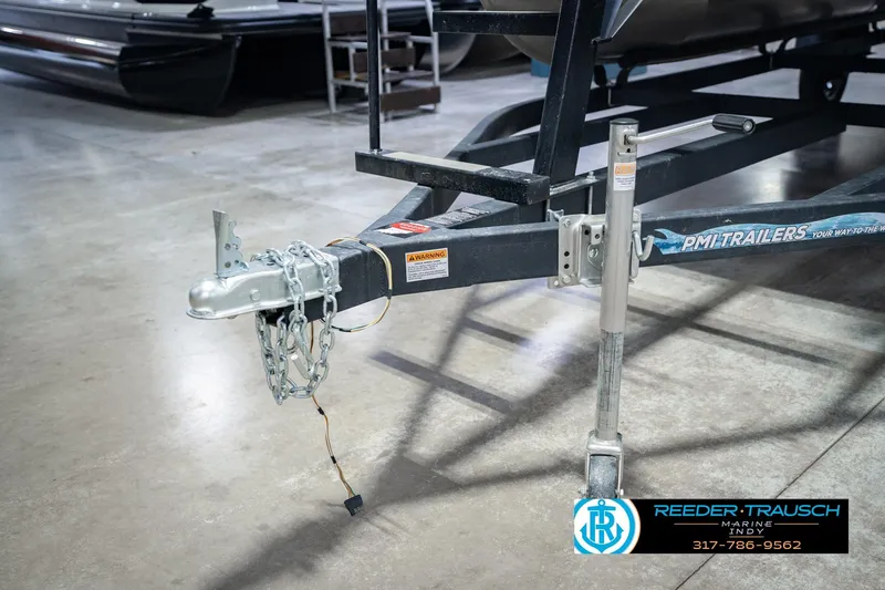 Slide: The Image of Trailer hitch of a 2025 Bennington 20 SLS pontoon boat in a showroom. - 62