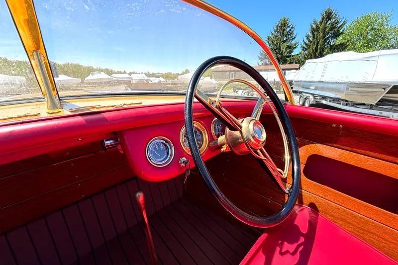 Slide: The Image of 1956 Chris-Craft Capri 21 boat interior with vintage steering wheel and dashboard. - 21