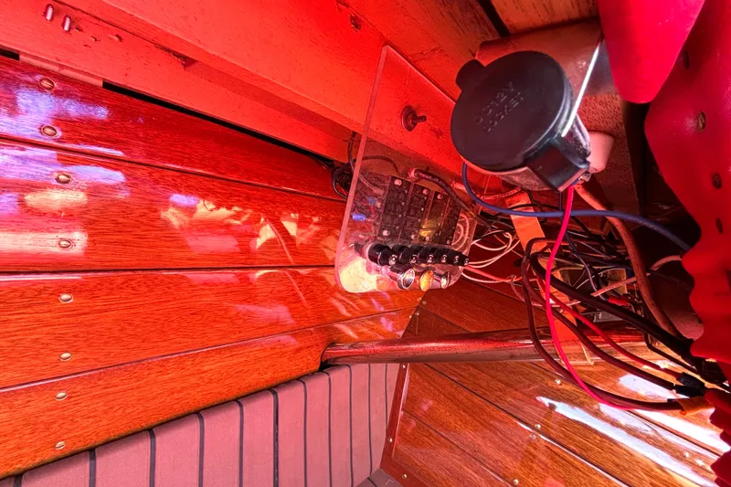 Slide: The Image of 1956 Chris-Craft Capri 21 dashboard with vintage wooden paneling and wiring. - 25