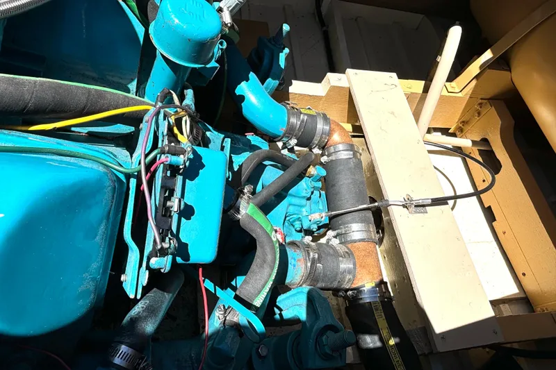 Slide: The Image of 1956 Chris-Craft Capri 21 engine compartment with visible wiring and components. - 30