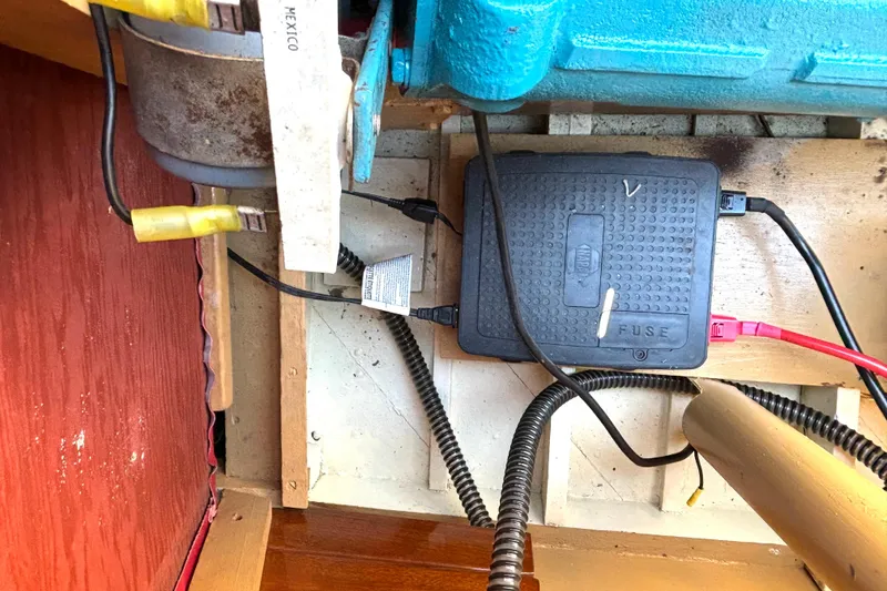 Slide: The Image of 1956 Chris-Craft Capri 21 engine compartment with wiring and fuse box. - 31