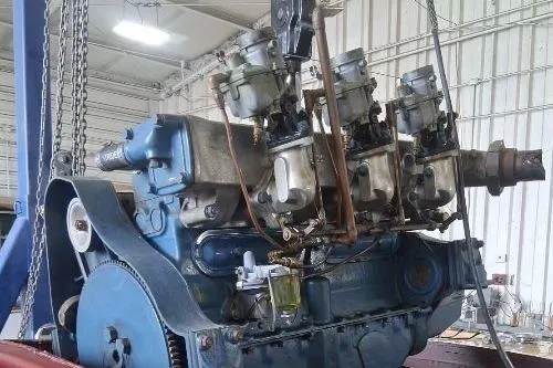 Slide: The Image of 1956 Chris-Craft Capri 21 engine in a workshop setting. - 32