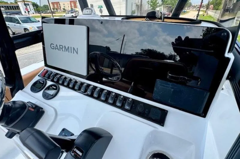 Slide: The Image of Dashboard of Sea Hunt Ultra 219 boat with Garmin display, year 2026. - 17