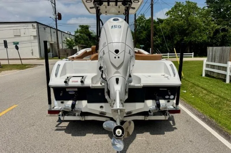 Slide: The Image of Rear view of a 2026 Sea Hunt Ultra 219 boat with outboard motor. - 3