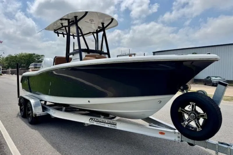 Slide: The Image of 2026 Sea Hunt Ultra 219 boat on trailer, side view. - 5