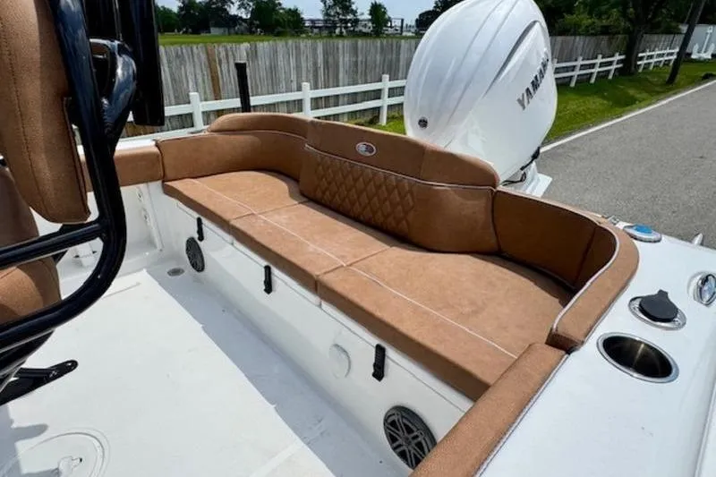 Slide: The Image of Interior of Sea Hunt Ultra 219 boat, 2026 model, featuring brown upholstery. - 7