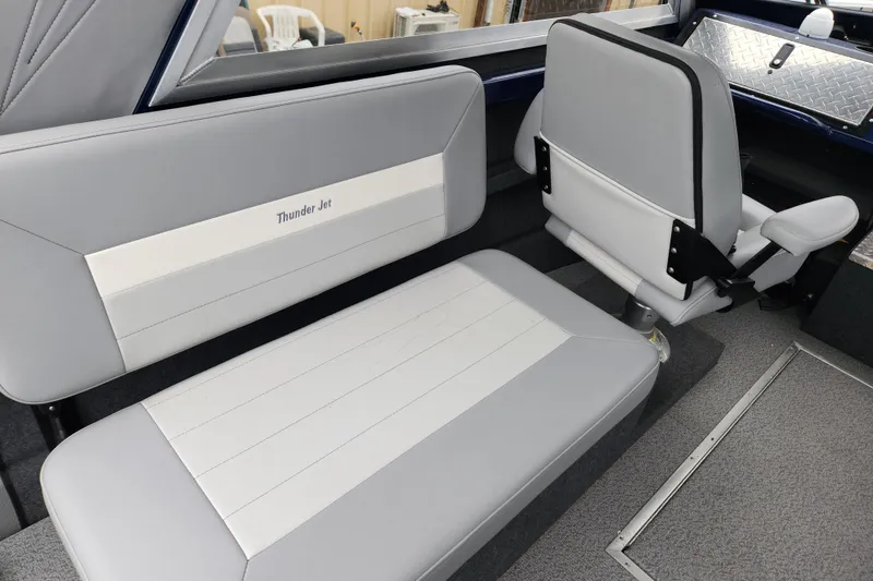 Slide: The Image of Interior seating of 2025 Thunder Jet 21 Chinook OS boat, featuring gray and white upholstery. - 17