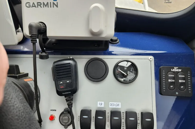 Slide: The Image of Control panel of 2025 Thunder Jet 21 Chinook OS with Garmin device and switches. - 20
