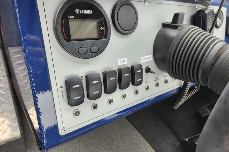 Slide: The Image of Control panel of 2025 Thunder Jet 21 Chinook OS boat with Yamaha tachometer. - 21