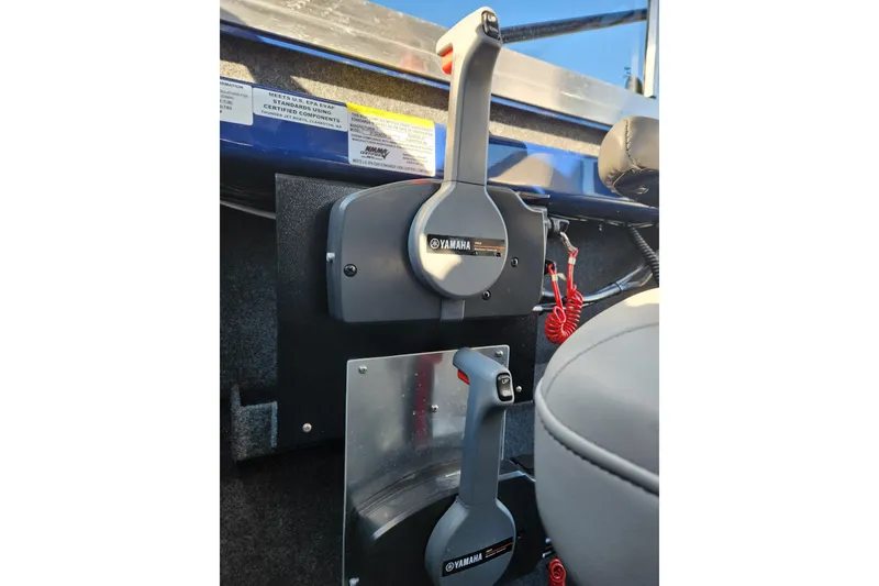 Slide: The Image of Throttle controls inside a 2025 Thunder Jet 21 Chinook OS boat cockpit. - 24