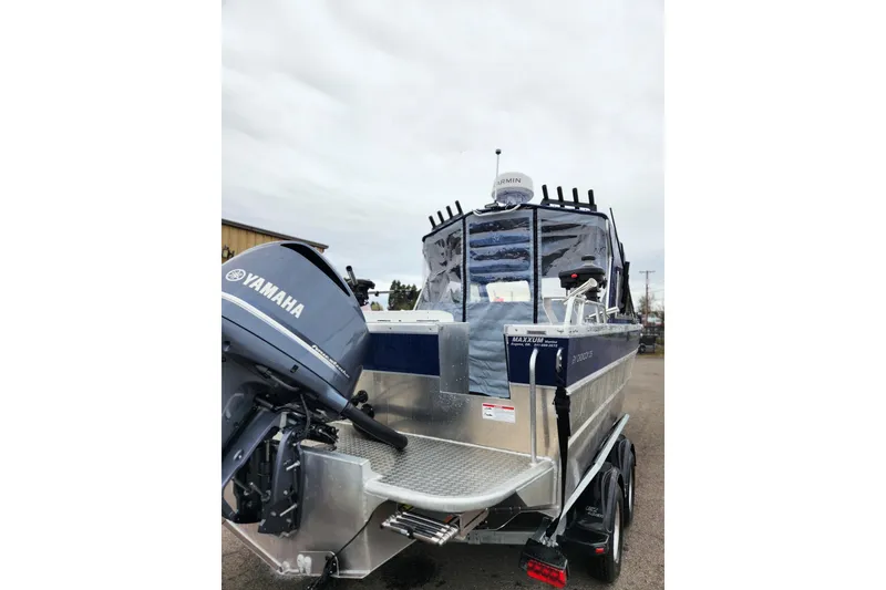 Slide: The Image of 2025 Thunder Jet 21 Chinook OS boat with Yamaha outboard motor, parked on a trailer. - 5
