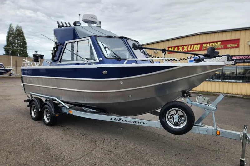Slide: The Image of 2025 Thunder Jet 21 Chinook OS boat on trailer at Maxxum Marine dealership. - 7