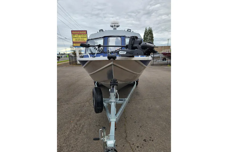 Slide: The Image of 2025 Thunder Jet 21 Chinook OS boat on trailer at Maxxum Marine dealership. - 8