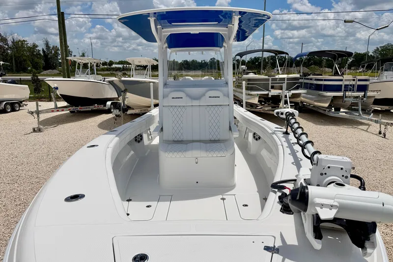 Slide: The Image of 2025 Bluewater 25t boat with sleek design, displayed in a marina under a blue sky. - 10