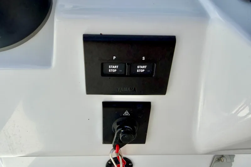 Slide: The Image of Control panel of a 2025 Bluewater 25t boat featuring Yamaha start/stop buttons. - 20