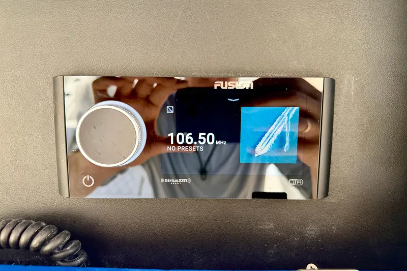 Slide: The Image of Fusion marine stereo display on Bluewater 25t, tuned to 106.50 MHz, 2025 model. - 24