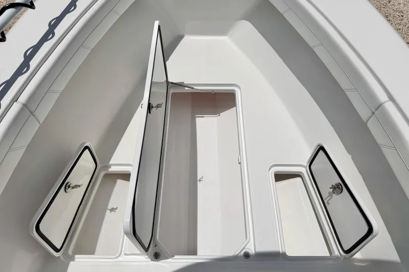 Slide: The Image of Open storage compartments on a 2025 Bluewater 25t boat deck. - 40