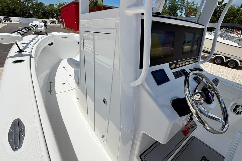 Slide: The Image of 2025 Bluewater 25t boat interior with modern helm and sleek design. - 46