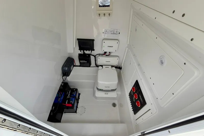 Slide: The Image of Interior of 2025 Bluewater 25t boat featuring electrical components and compact toilet. - 47