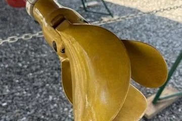 Slide: The Image of Propeller of 2003 Beneteau 423 sailboat on gravel surface. - 12