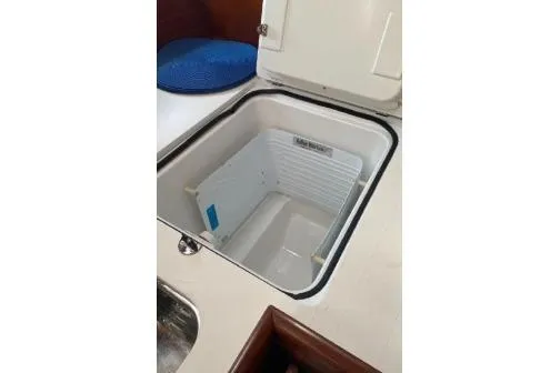 Slide: The Image of Open storage compartment on 2003 Beneteau 423 yacht, showcasing interior space. - 20