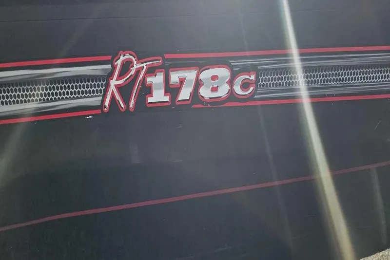 Slide: The Image of 2018 Ranger RT178C logo with red and white detailing on a dark background. - 2