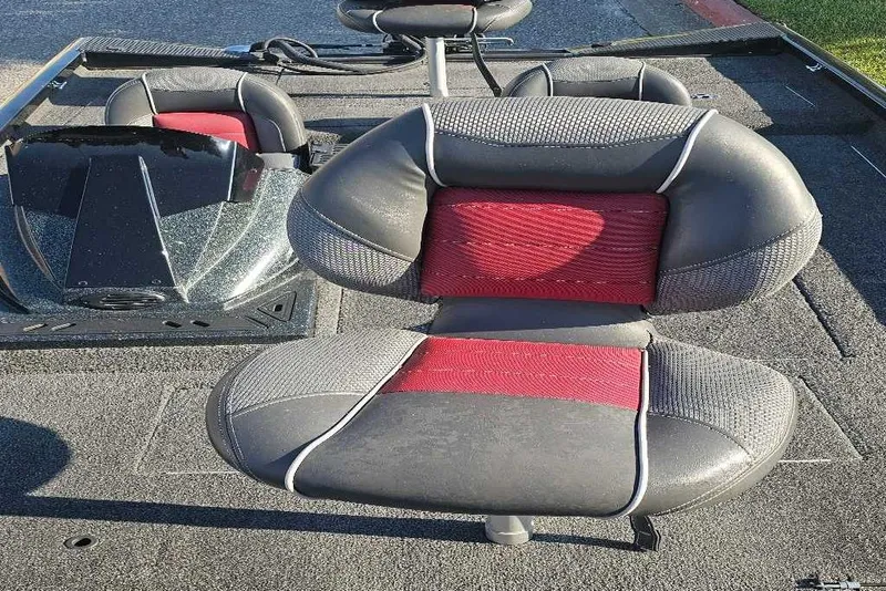 Slide: The Image of 2018 Ranger RT178C boat interior with red and black cushioned seats. - 4