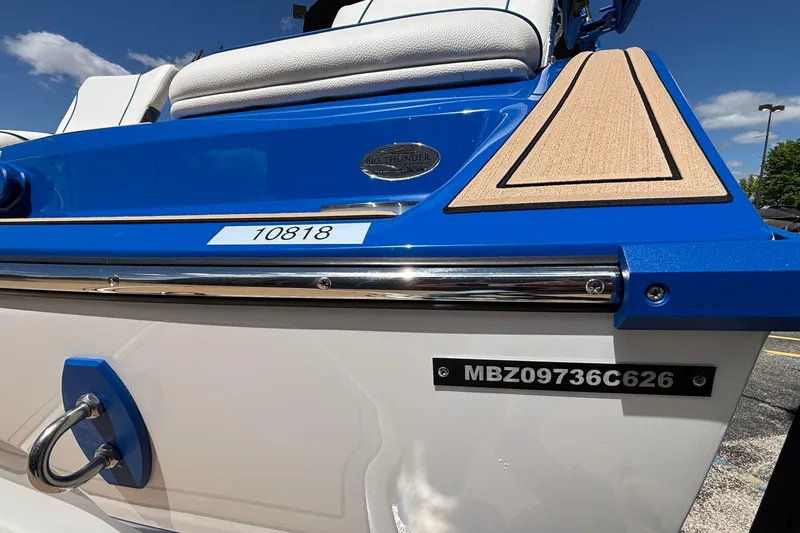 Slide: The Image of 2026 MB B52 23 Alpha boat, blue and white design, with registration number MBZ09736C626. - 13