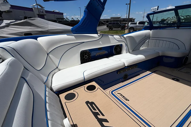 Slide: The Image of Luxurious interior of 2026 MB B52 23 Alpha boat with white seating and blue accents. - 21