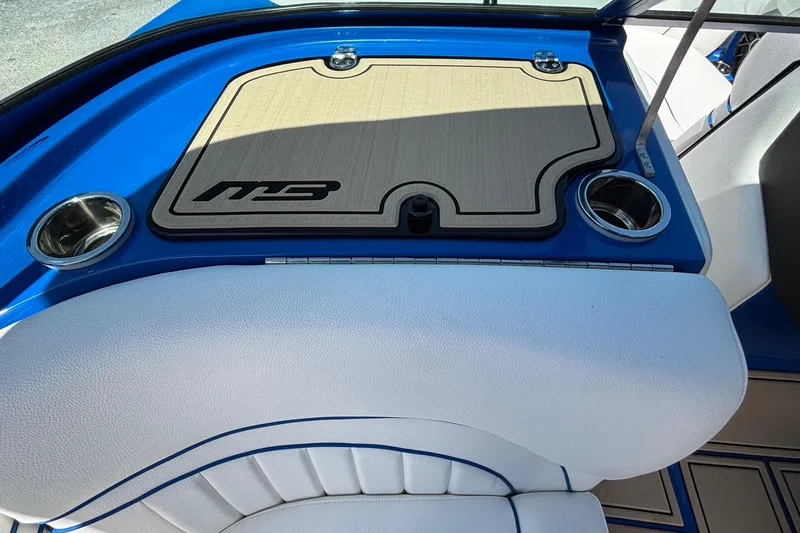 Slide: The Image of Interior of 2026 MB B52 23 Alpha boat with cup holders and logo mat. - 37