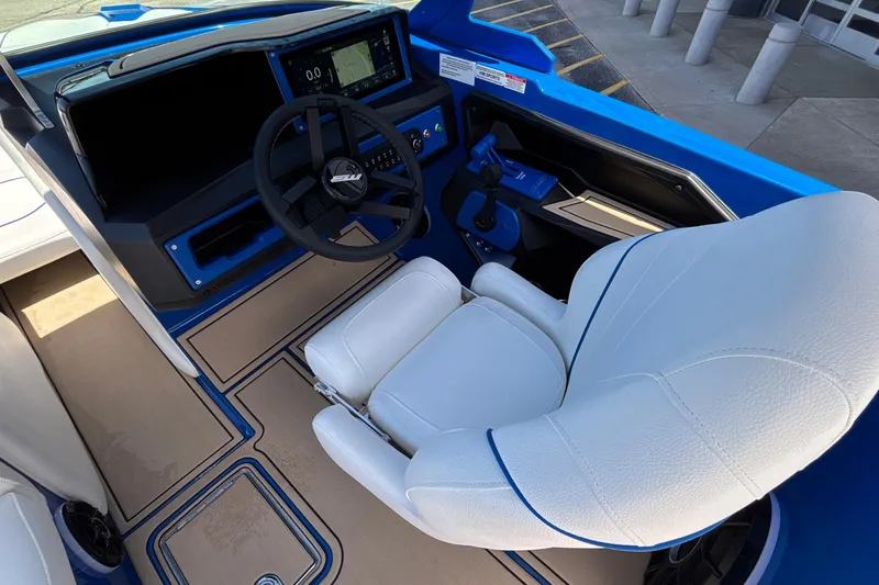 Slide: The Image of Interior of 2026 MB B52 23 Alpha boat with steering wheel and white seat. - 40