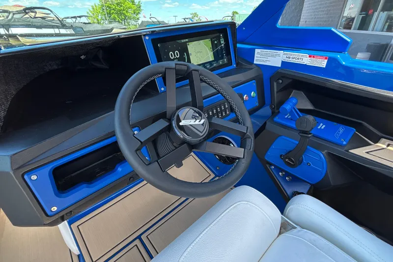 Slide: The Image of Interior of 2026 MB B52 23 Alpha boat with modern steering and dashboard controls. - 41