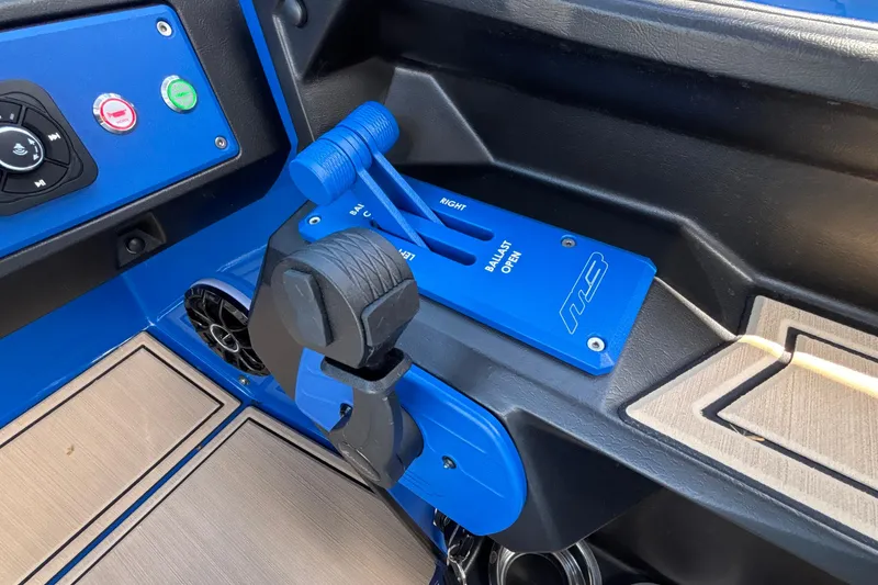 Slide: The Image of Control panel of 2026 MB B52 23 Alpha boat with blue throttle and switches. - 44
