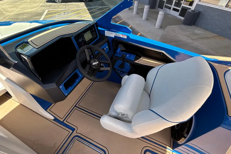 Slide: The Image of Interior of 2026 MB B52 23 Alpha boat with modern dashboard and white captain's chair. - 45