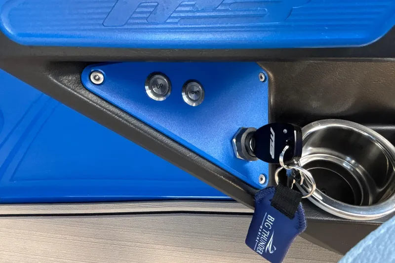 Slide: The Image of Control panel of 2026 MB B52 23 Alpha boat with key and cup holder. - 47