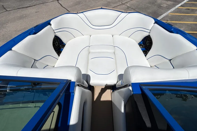 Slide: The Image of Luxurious interior of 2026 MB B52 23 Alpha boat with white seating and blue accents. - 49